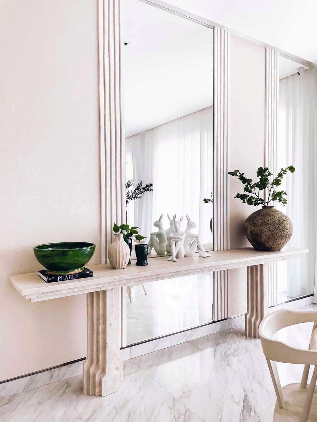 Stylish light beige layered travertine long console table.