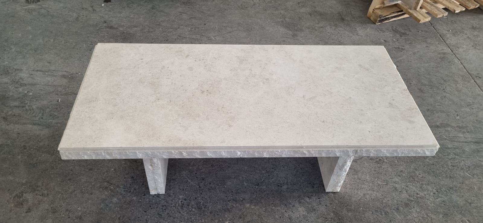 Omani marble beige raw edged coffee table.