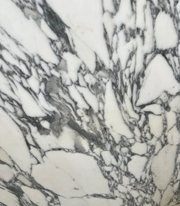 Grey and white veined Arabescato marble stone sample.