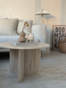 Travertine round coffee table with Y base in living room