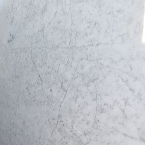 White and grey veined Carrara Marble stone sample.