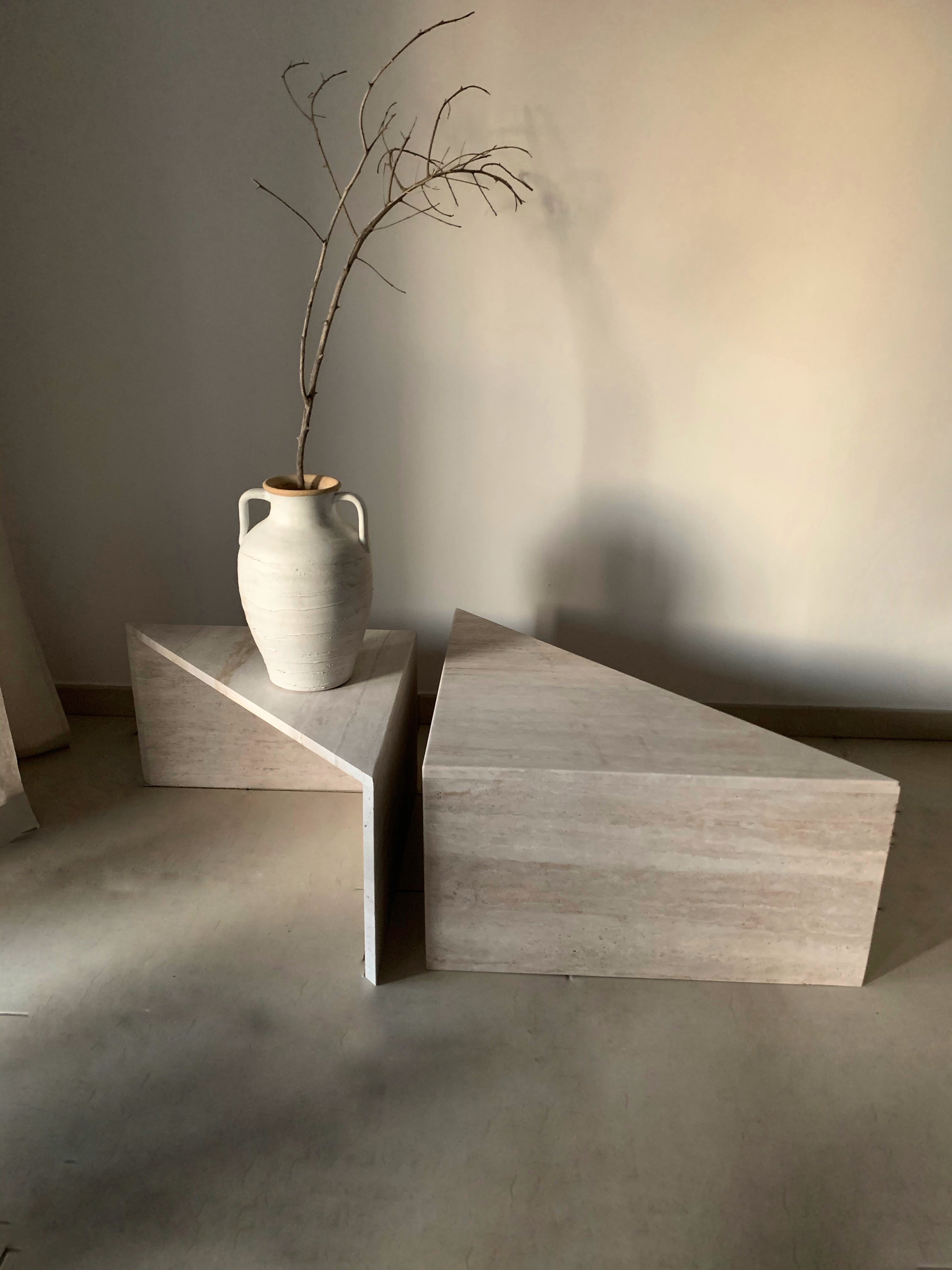 Esquina triangle travertine coffee tables arranged in different design layout