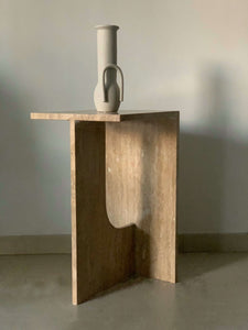 Travertine side table with vase