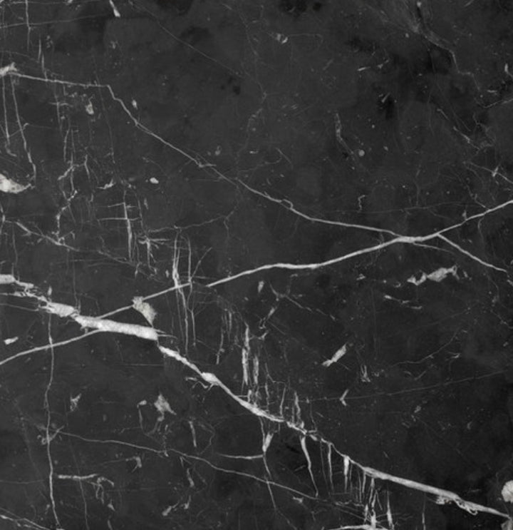 Black Marquina marble with white veining stone sample.