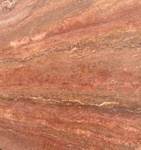 Red travertine stone sample.